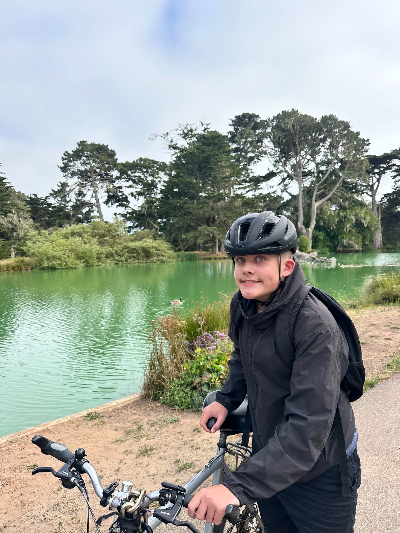 Young rider building bicycle confidence during a private bike lesson in Golden Gate Park, San Francisco