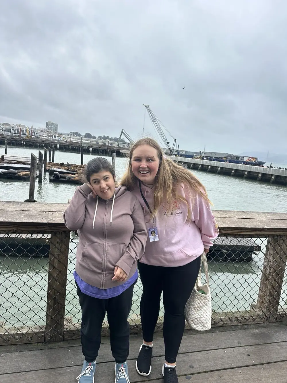 Olivia and a participant enjoying a personalized community outing by the San Francisco waterfront